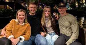 Two couples posing for a photo