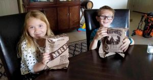 Lizann’s children holding MREs